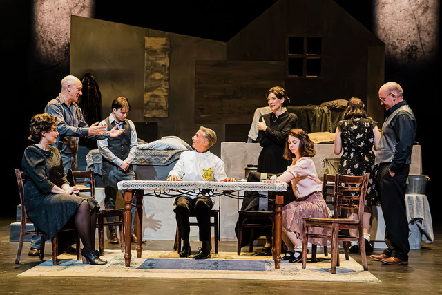 A tender scene around the table inside the Secret Annex